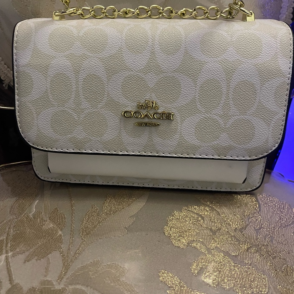 Coach White Crossbody Bag with Gold Chain Strap and Flap Closure